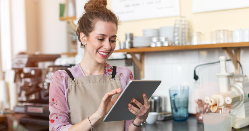 A woman looking at access banking on her tablet