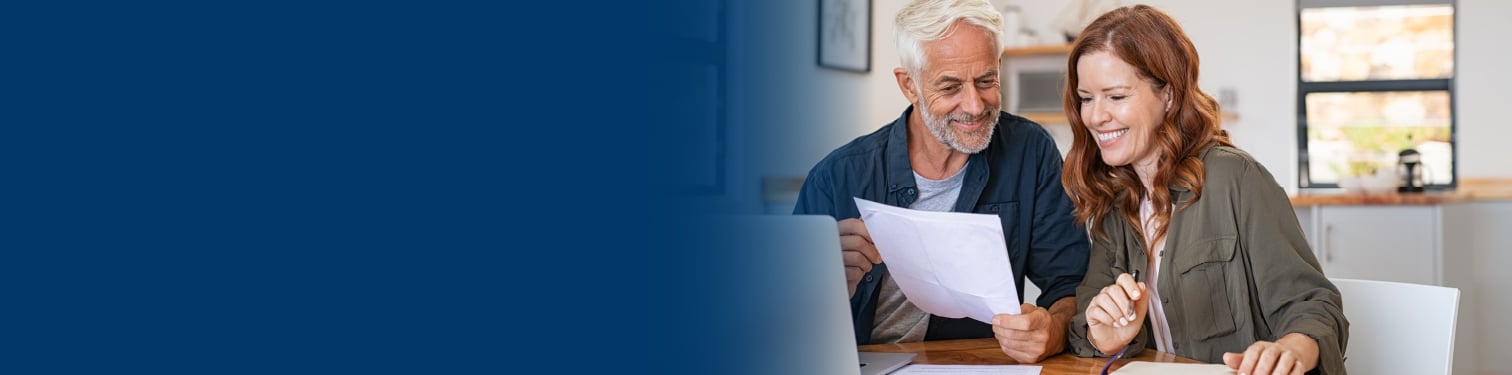 A couple looking at loan documents