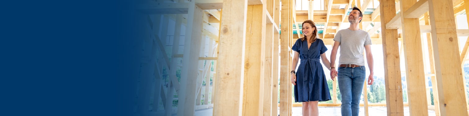 A couple walking around their new house build