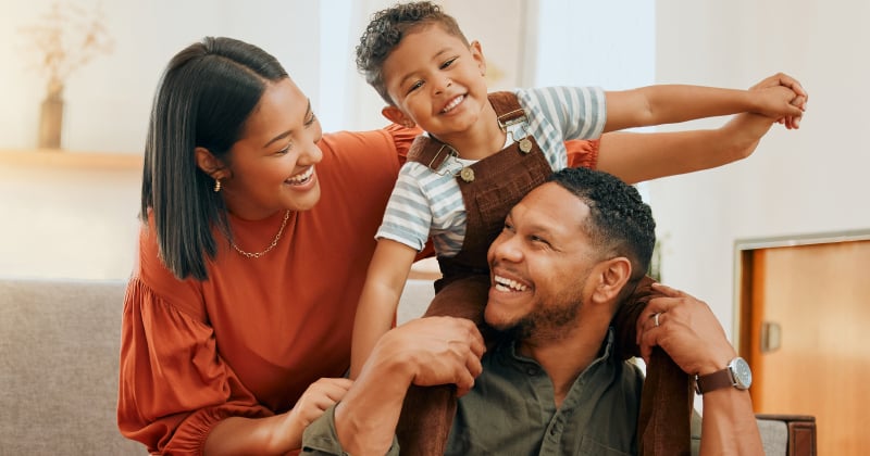 A family playing together on the couch